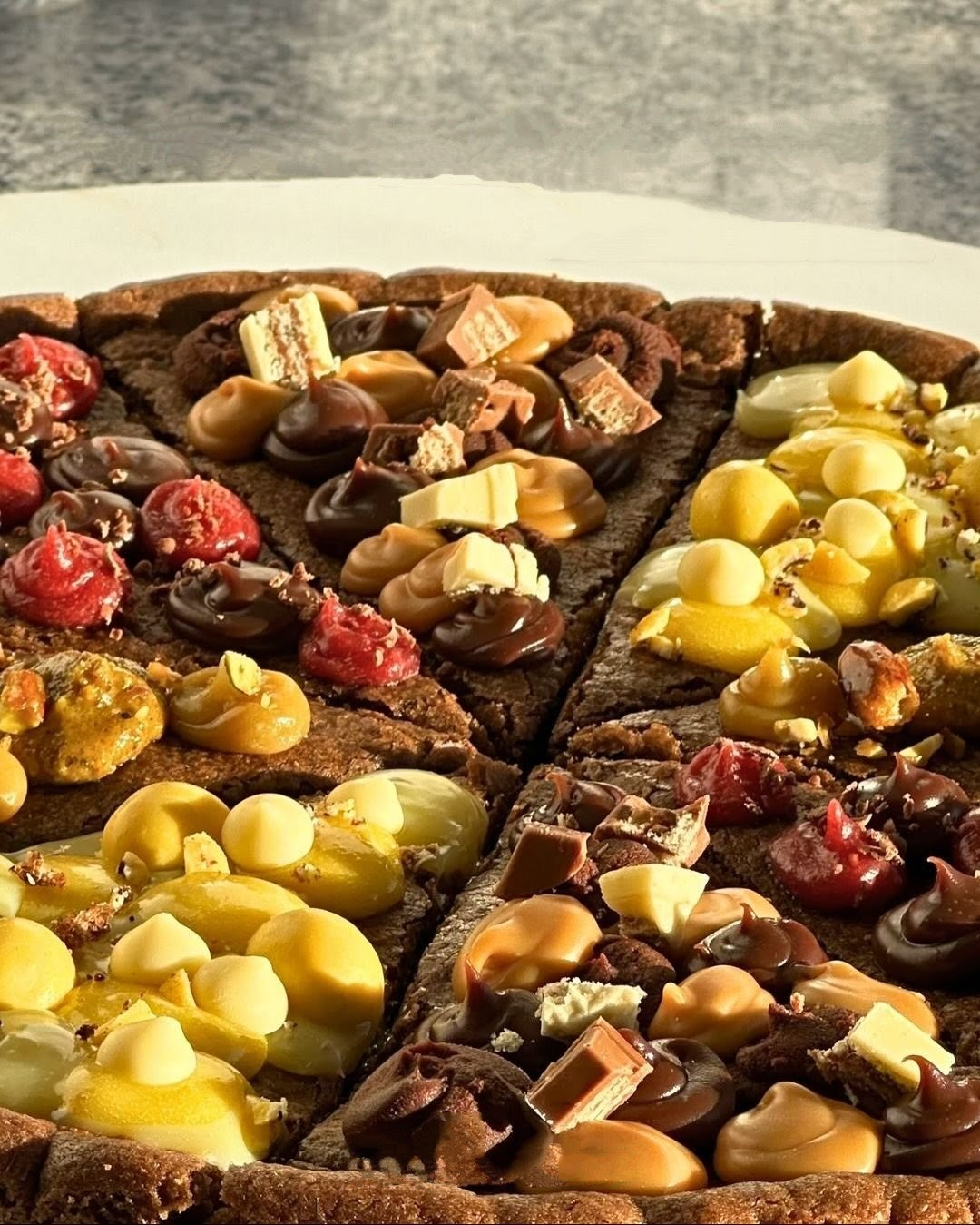 Imagen del artículo: Cookies en forma de pizza, el nuevo vicio dulce de la ciudad